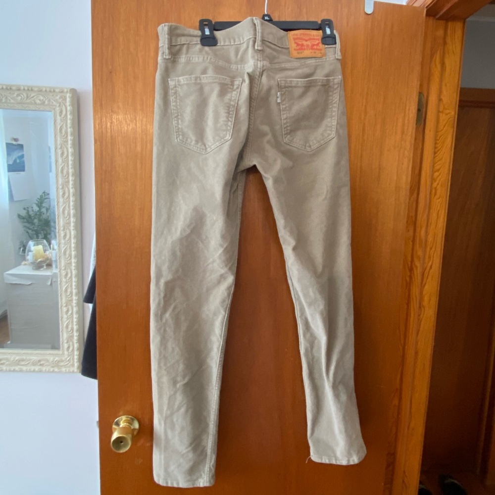 Khaki/beige colored corduroy Levi’s. Straight leg